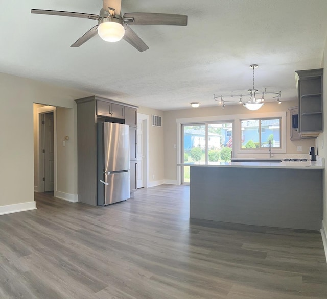 230 Northridge Ave, Bolingbrook, IL 60440 - kitchen with freestanding refrigerator, gray cabinets, wood finished floors, open shelves, and a peninsula