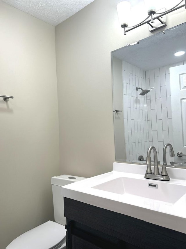 230 Northridge Ave, Bolingbrook, IL 60440 - full bathroom with vanity, a tile shower, and a textured ceiling