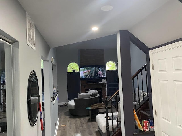 1014 Rockport Dr, Carol Stream, IL 60188 - living area featuring wood finished floors, stairway, and vaulted ceiling