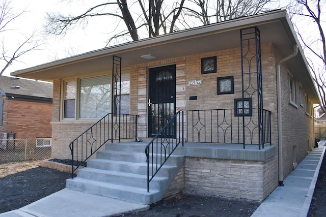 12152 S Union Ave, Chicago, IL 60628 - view of front of home featuring brick siding and covered porch