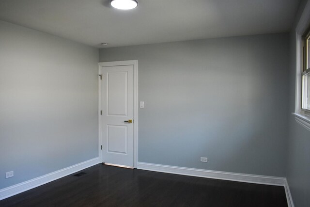 12152 S Union Ave, Chicago, IL 60628 - spare room with baseboards and dark wood finished floors