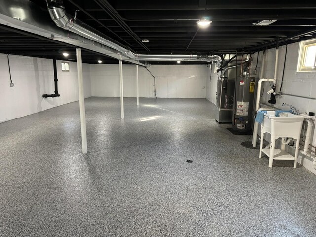 12152 S Union Ave, Chicago, IL 60628 - basement with gas water heater and a sink