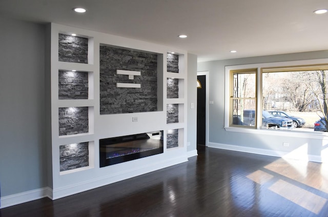 12152 S Union Ave, Chicago, IL 60628 - unfurnished living room featuring wood finished floors, built in features, and recessed lighting