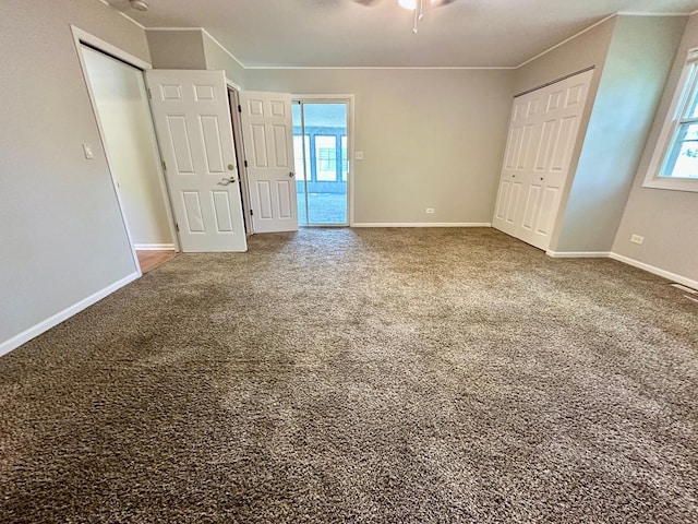 899 Carl Ave, Elgin, IL 60120 - unfurnished bedroom featuring multiple windows and carpet