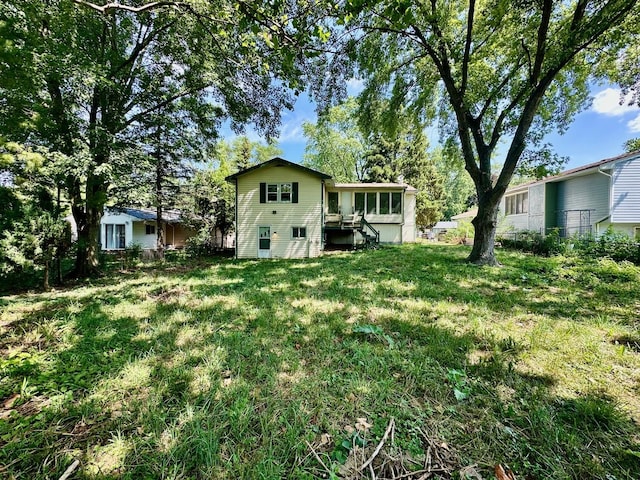 899 Carl Ave, Elgin, IL 60120 - rear view of property featuring a lawn