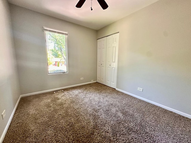 899 Carl Ave, Elgin, IL 60120 - unfurnished bedroom with carpet flooring, a closet, and a ceiling fan
