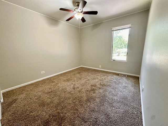 899 Carl Ave, Elgin, IL 60120 - carpeted empty room featuring ceiling fan and baseboards