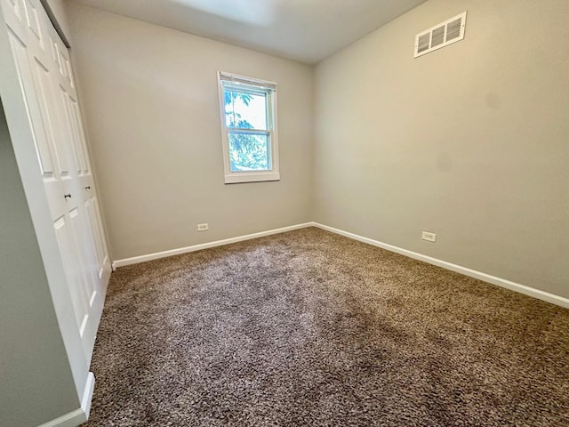 899 Carl Ave, Elgin, IL 60120 - unfurnished bedroom featuring carpet and a closet