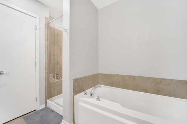 500 W Superior St Unit 1207, Chicago, IL 60654 - bathroom featuring a garden tub, a stall shower, and tile patterned floors