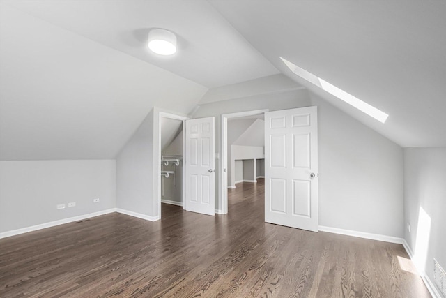 2726 W Thomas St, Chicago, IL 60622 - additional living space with a skylight, vaulted ceiling, and wood finished floors