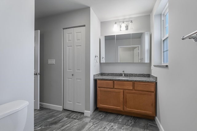 2726 W Thomas St, Chicago, IL 60622 - bathroom featuring a closet, vanity, and marble finish floors
