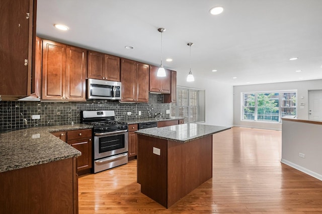 2726 W Thomas St, Chicago, IL 60622 - kitchen with appliances with stainless steel finishes, light wood-type flooring, backsplash, and recessed lighting