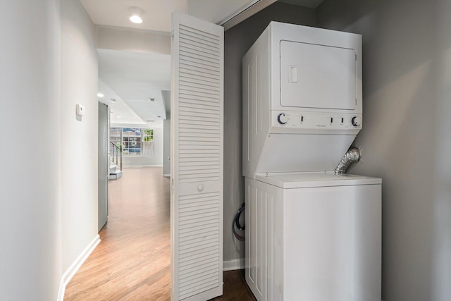 2726 W Thomas St, Chicago, IL 60622 - washroom featuring stacked washer / drying machine and wood finished floors