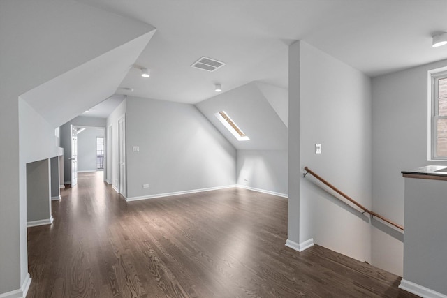 2726 W Thomas St, Chicago, IL 60622 - additional living space with a skylight, healthy amount of natural light, wood finished floors, and vaulted ceiling
