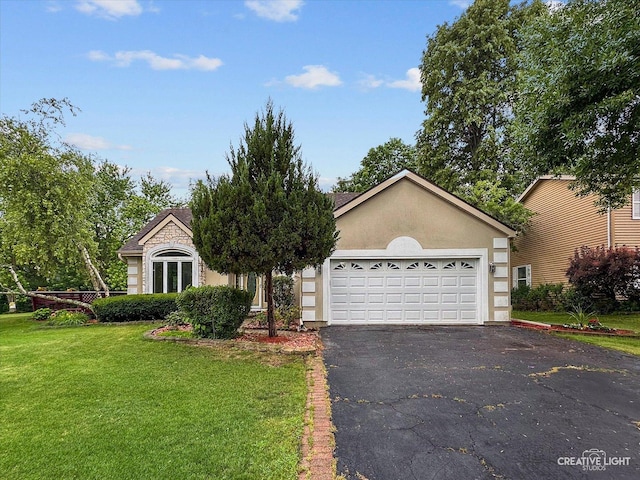 116 Pipers Dr, Bartlett, IL 60103 - view of front facade with asphalt driveway, a front lawn, stucco siding, and an attached garage
