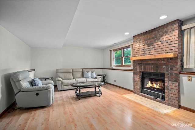 116 Pipers Dr, Bartlett, IL 60103 - living room featuring wood finished floors, a brick fireplace, and recessed lighting