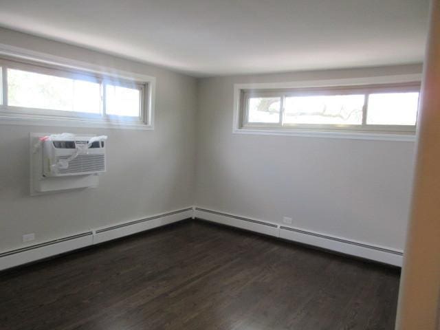 2012 W 111th St Unit 3S, Chicago, IL 60643 - spare room featuring dark wood-type flooring and baseboard heating