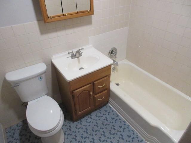 2012 W 111th St Unit 3S, Chicago, IL 60643 - full bathroom featuring tile walls, vanity, tile patterned floors, and  shower combination