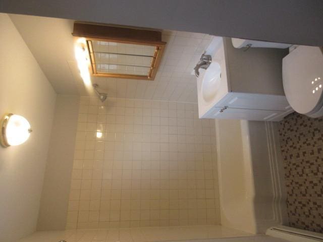 2012 W 111th St Unit 3S, Chicago, IL 60643 - full bath featuring a shower stall and a baseboard heating unit