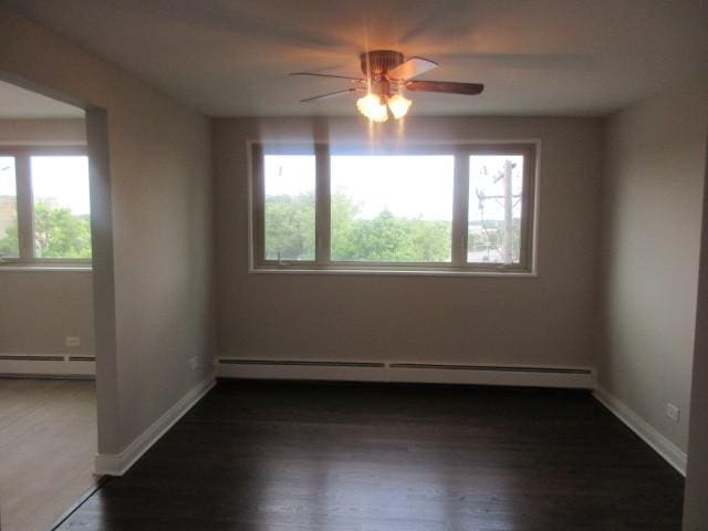 2012 W 111th St Unit 3S, Chicago, IL 60643 - spare room featuring healthy amount of natural light, a baseboard heating unit, and a ceiling fan