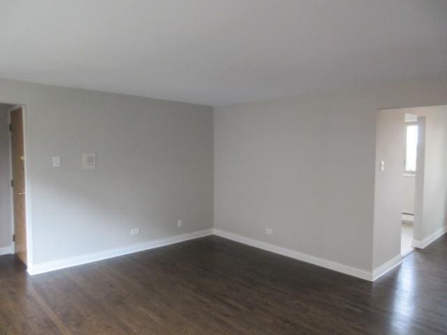 2012 W 111th St Unit 3S, Chicago, IL 60643 - empty room featuring dark wood finished floors and baseboards
