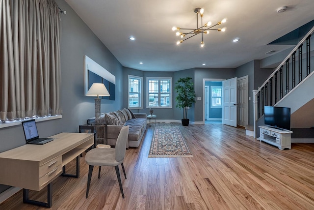 4826 W Potomac Ave, Chicago, IL 60651 - living room featuring wood finished floors, a chandelier, recessed lighting, and stairway