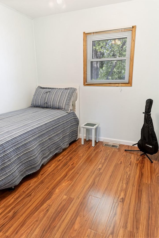 509 Waverly Ave, Streamwood, IL 60107 - bedroom with wood finished floors and baseboards