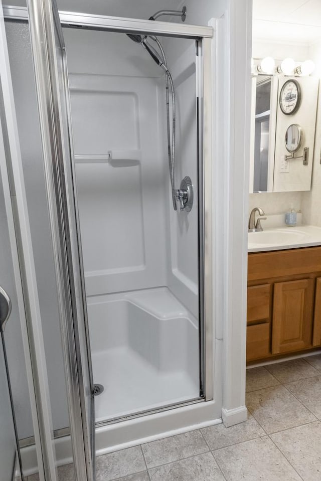 509 Waverly Ave, Streamwood, IL 60107 - bathroom featuring a stall shower, vanity, and tile patterned floors