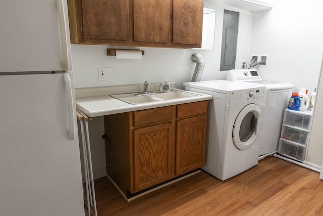 509 Waverly Ave, Streamwood, IL 60107 - washroom with electric panel, hookup for a washing machine, and light wood-type flooring