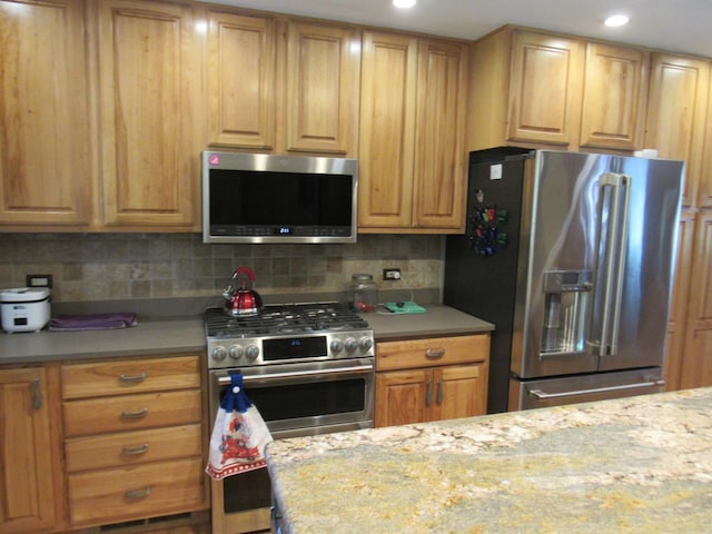 24099 W Haidi Ln, Lake Villa, IL 60046 - kitchen with appliances with stainless steel finishes, tasteful backsplash, and recessed lighting