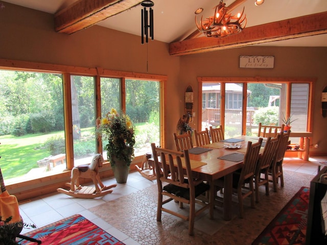 24099 W Haidi Ln, Lake Villa, IL 60046 - dining space featuring light tile patterned floors, beam ceiling, a chandelier, and high vaulted ceiling