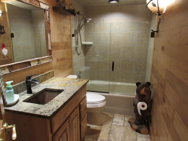 24099 W Haidi Ln, Lake Villa, IL 60046 - bathroom with vanity, combined bath / shower with glass door, and stone finish floors