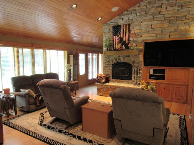 24099 W Haidi Ln, Lake Villa, IL 60046 - living area with vaulted ceiling, light wood-style floors, wooden ceiling, a stone fireplace, and recessed lighting