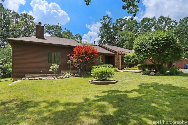 24099 W Haidi Ln, Lake Villa, IL 60046 - rear view of property with a yard and a chimney