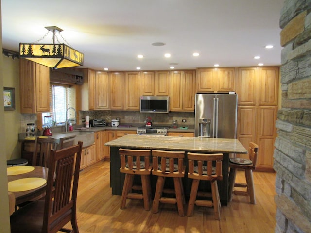 24099 W Haidi Ln, Lake Villa, IL 60046 - kitchen with appliances with stainless steel finishes, decorative backsplash, light wood-style floors, recessed lighting, and light countertops