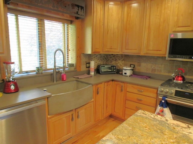24099 W Haidi Ln, Lake Villa, IL 60046 - kitchen featuring appliances with stainless steel finishes, light countertops, and light wood-style flooring