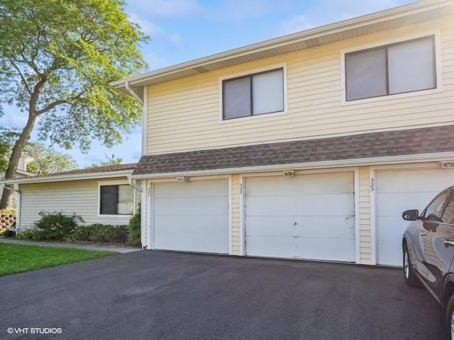 325 Bayview Pt, Schaumburg, IL 60194 - view of front of house featuring driveway, an attached garage, and a shingled roof