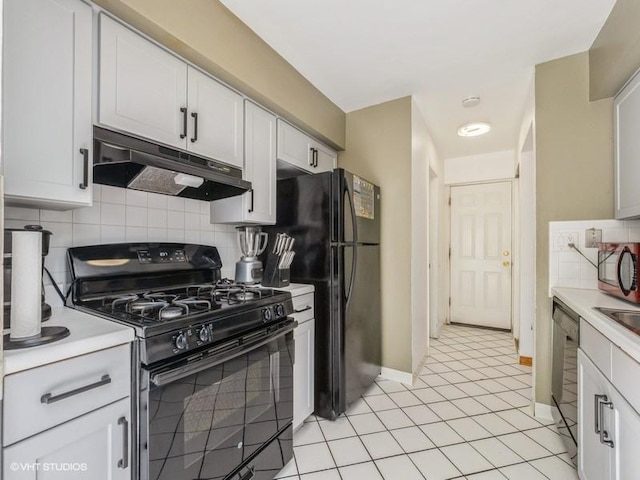 325 Bayview Pt, Schaumburg, IL 60194 - kitchen with black appliances, under cabinet range hood, decorative backsplash, and light countertops