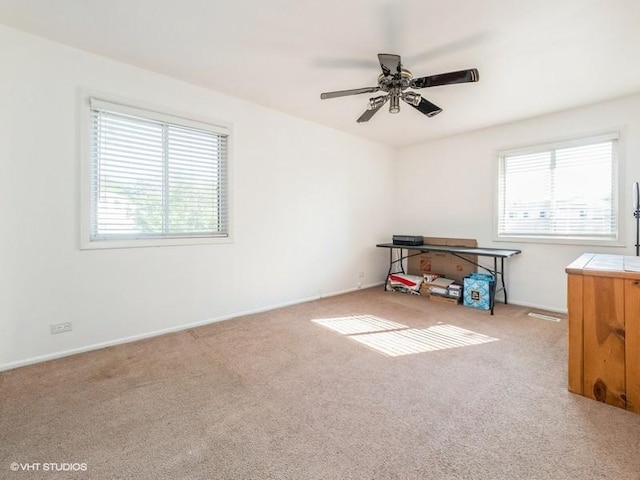 325 Bayview Pt, Schaumburg, IL 60194 - empty room featuring plenty of natural light, carpet flooring, and a ceiling fan