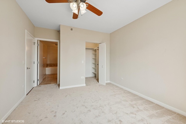 330 W Grand Ave Unit 1101, Chicago, IL 60654 - unfurnished bedroom with carpet flooring, ensuite bath, a walk in closet, and a ceiling fan
