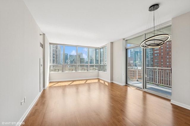 330 W Grand Ave Unit 1101, Chicago, IL 60654 - empty room with wood finished floors and a skyline view