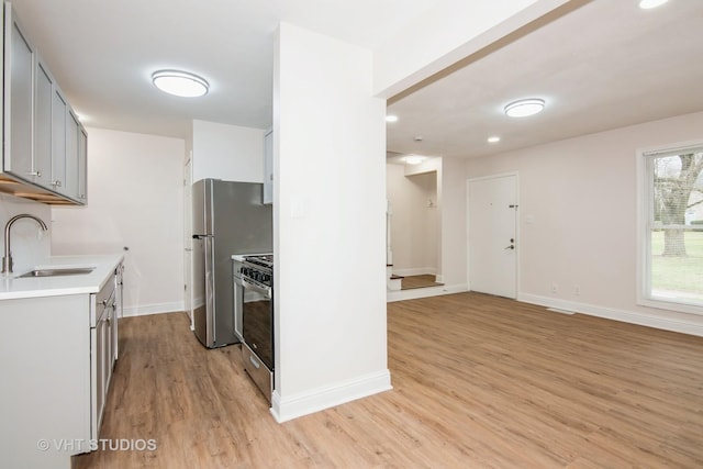 452 Mallview Ln, Bolingbrook, IL 60440 - kitchen with stainless steel appliances, gray cabinetry, light wood finished floors, light countertops, and recessed lighting