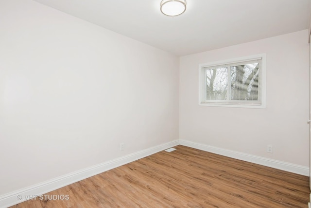 452 Mallview Ln, Bolingbrook, IL 60440 - spare room featuring baseboards and light wood-style floors