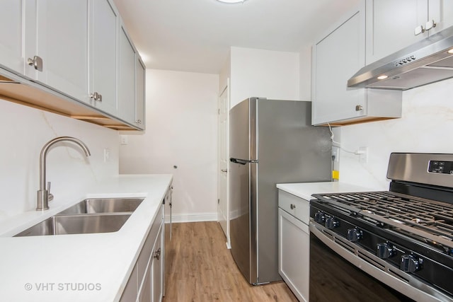 452 Mallview Ln, Bolingbrook, IL 60440 - kitchen featuring stainless steel appliances, under cabinet range hood, light countertops, and light wood-style floors
