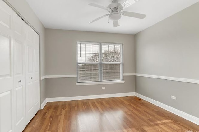 533 Jackson Blvd, Grayslake, IL 60030 - unfurnished bedroom featuring a closet, wood finished floors, and ceiling fan