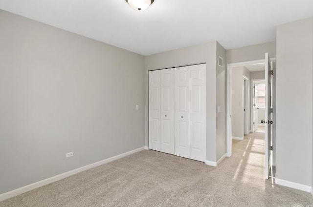 533 Jackson Blvd, Grayslake, IL 60030 - unfurnished bedroom featuring a closet and light carpet