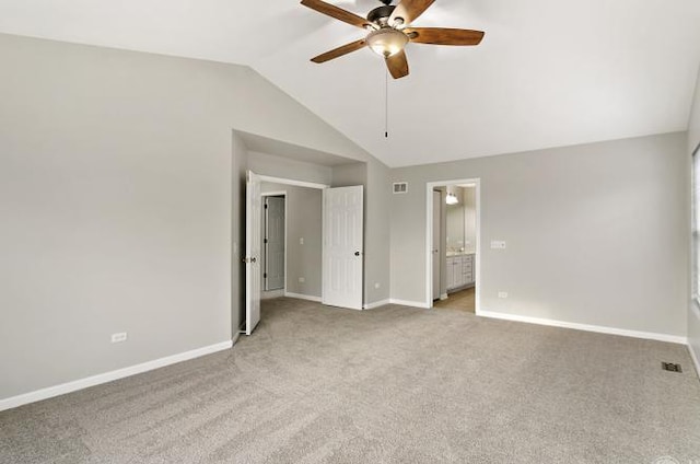 533 Jackson Blvd, Grayslake, IL 60030 - unfurnished bedroom with vaulted ceiling, light carpet, connected bathroom, and ceiling fan