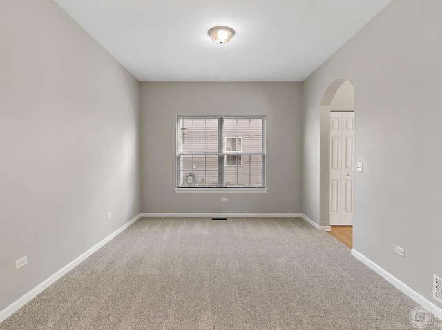 533 Jackson Blvd, Grayslake, IL 60030 - empty room with arched walkways and light colored carpet