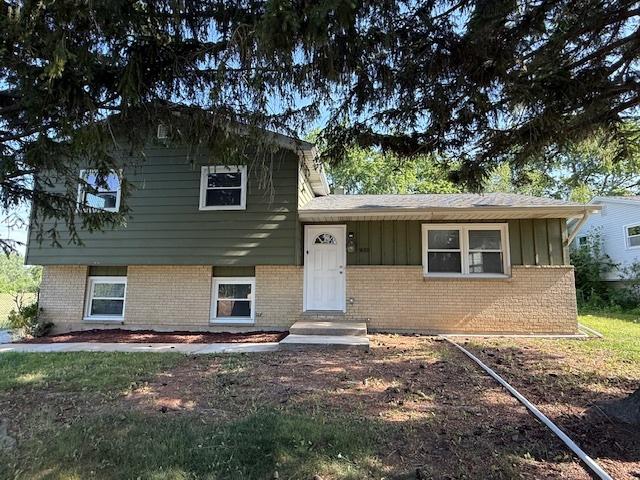 3018 20th St, North Chicago, IL 60064 - split level home with brick siding and board and batten siding