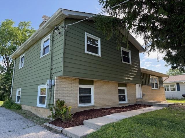 3018 20th St, North Chicago, IL 60064 - view of side of home featuring brick siding